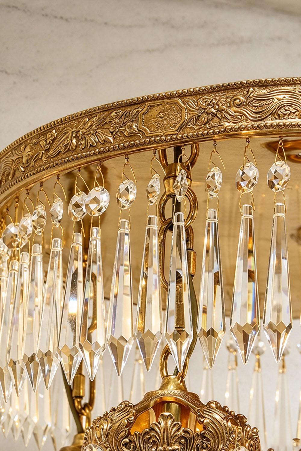 Ondaine Brass Crystal Cluster Flush Mount Chandelier | Cut Crystal and Brass | Close-up detail showing the carved brass rim and top crystal fringe | Samu Lamp