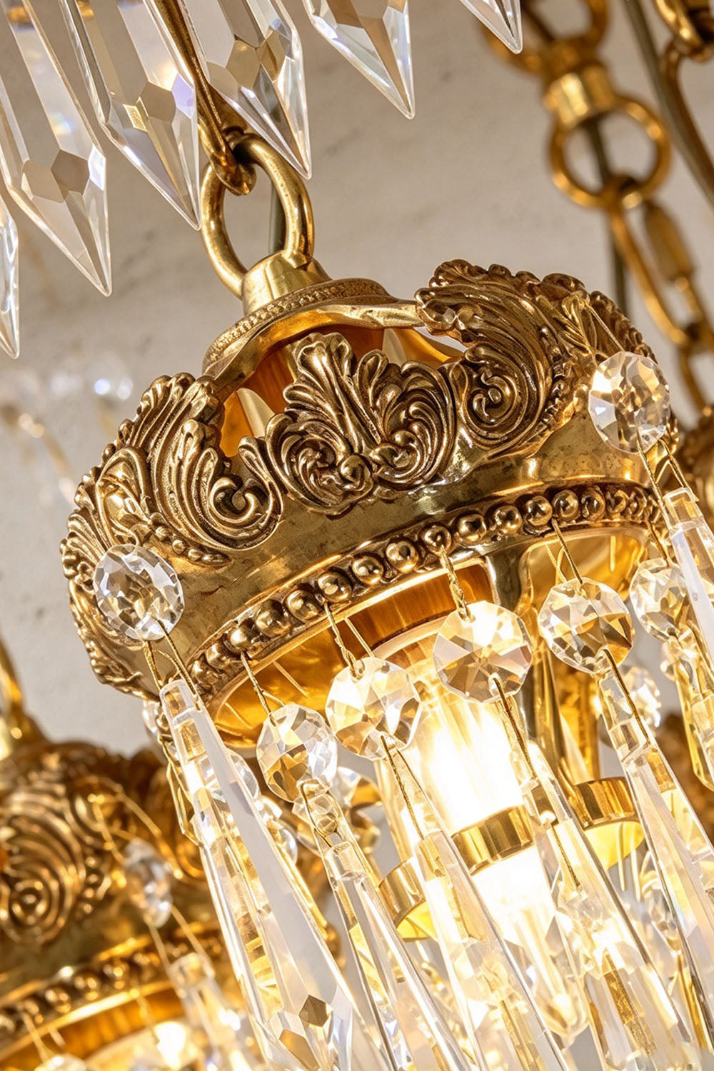 Ondaine Brass Crystal Cluster Flush Mount Chandelier | Cut Crystal and Brass | Macro detail shot of the ornate carved brass crown and crystal cluster | Samu Lamp