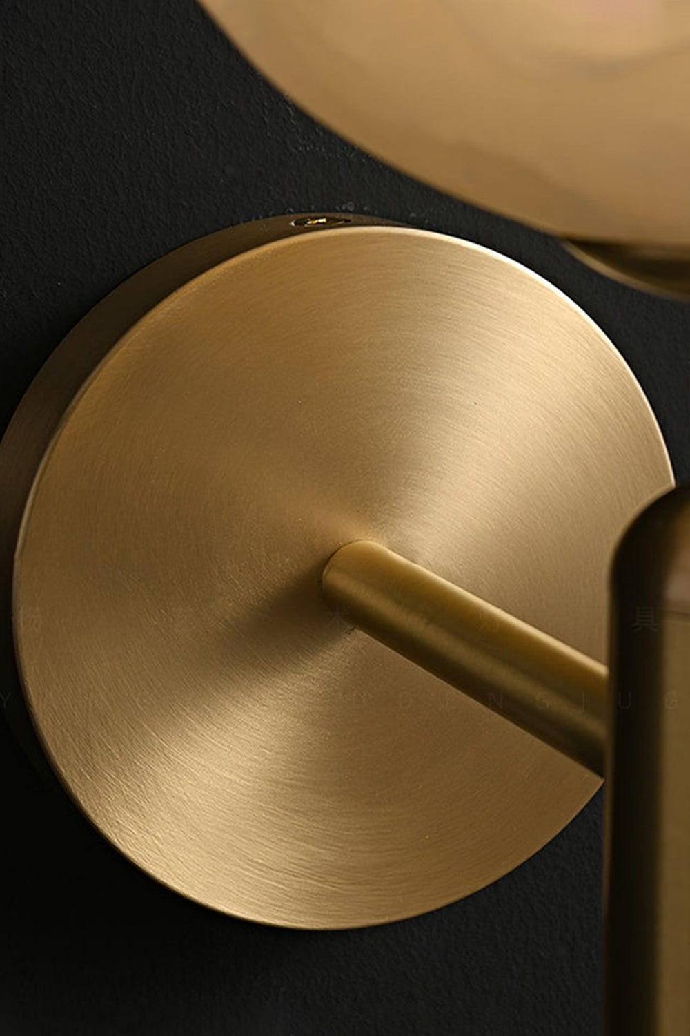Ondine Alabaster Blossom Wall Sconce | Natural Alabaster and Brass | Detailed macro shot focusing on the smooth finish of the circular brass backplate and stem bottom | Samu Lamp