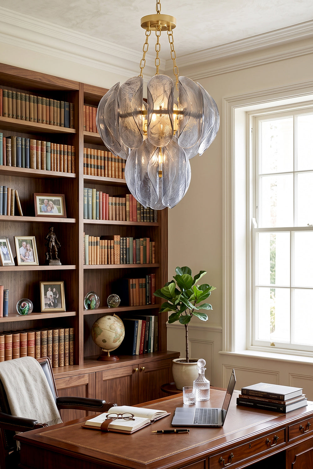 Ondine Cascading Leaf Glass Chandelier | Textured Smoked Glass and Gold Metal | Illuminating a sophisticated home library office filled with wooden bookshelves and a large executive desk | Samu Lamp