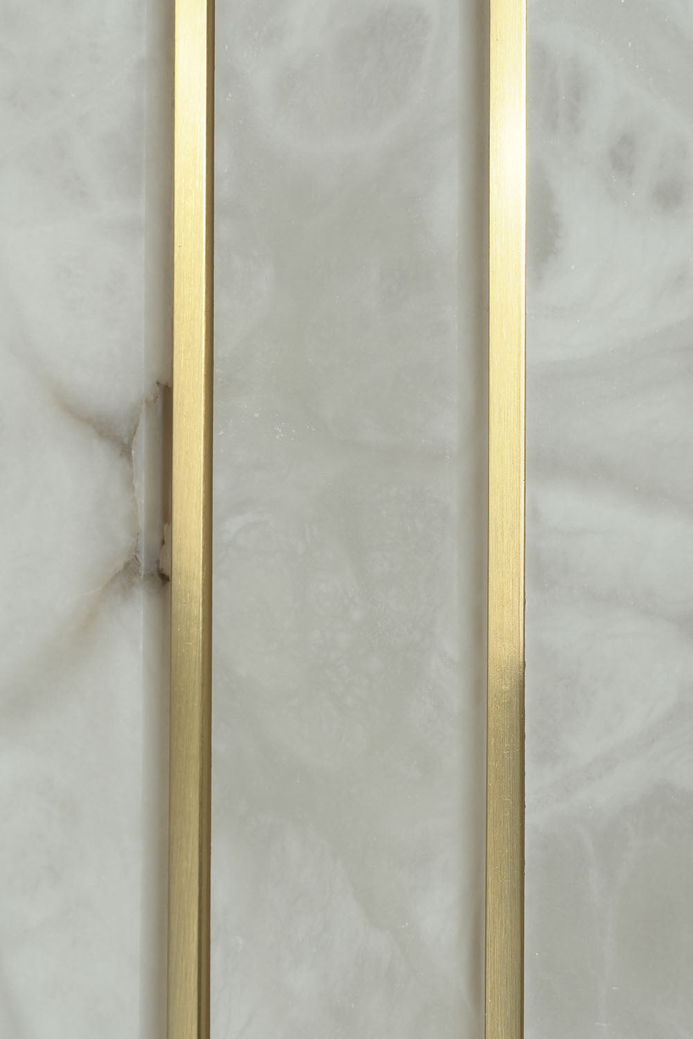 Ondrelle Bar Wall Sconce | Natural Carved Alabaster | Macro detail of mineral stone veining and brass bar | Samu Lamp