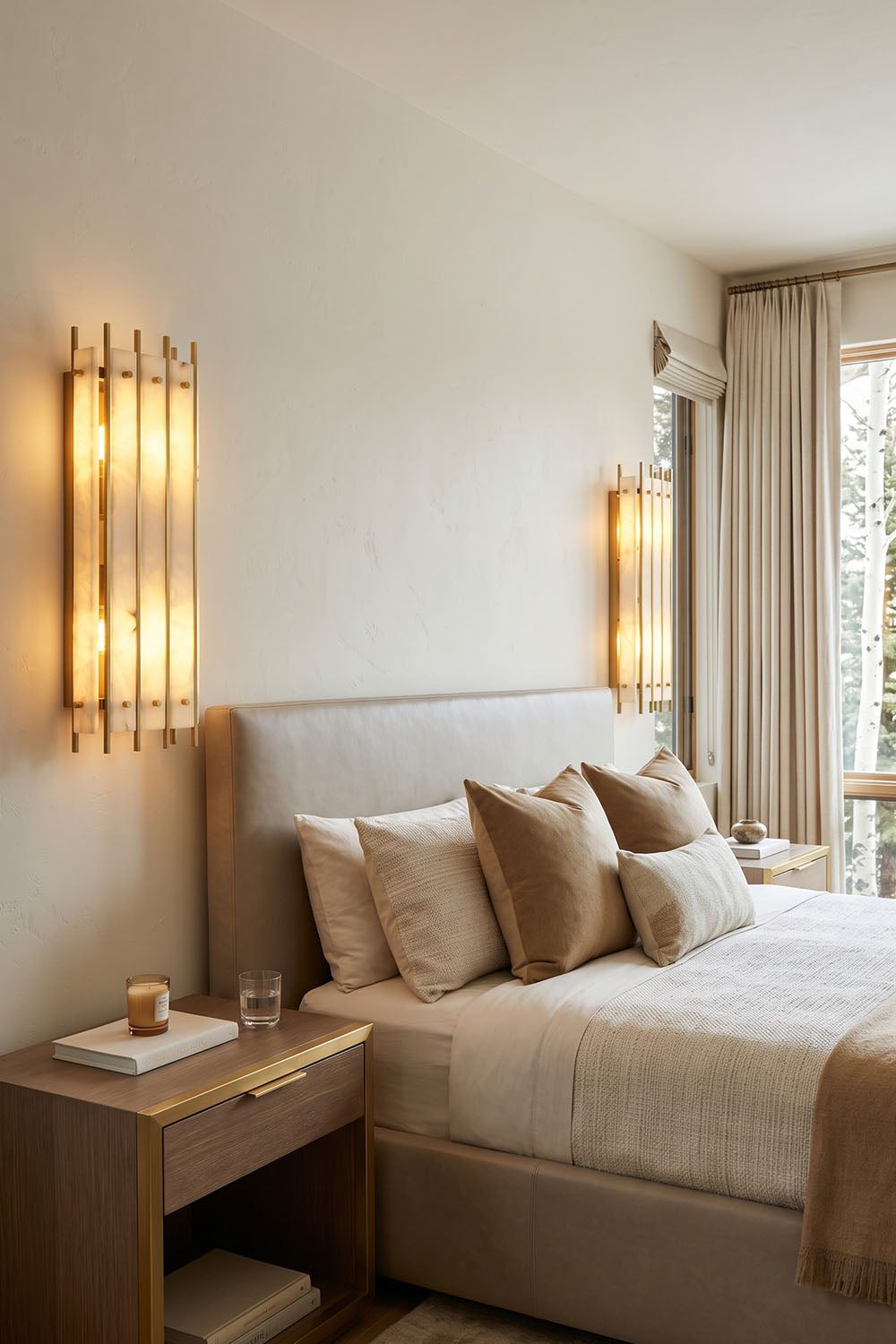 Ondrelle Bar Wall Sconce | Alabaster and Brass | Symmetrical pair mounted beside a headboard in bedroom | Samu Lamp