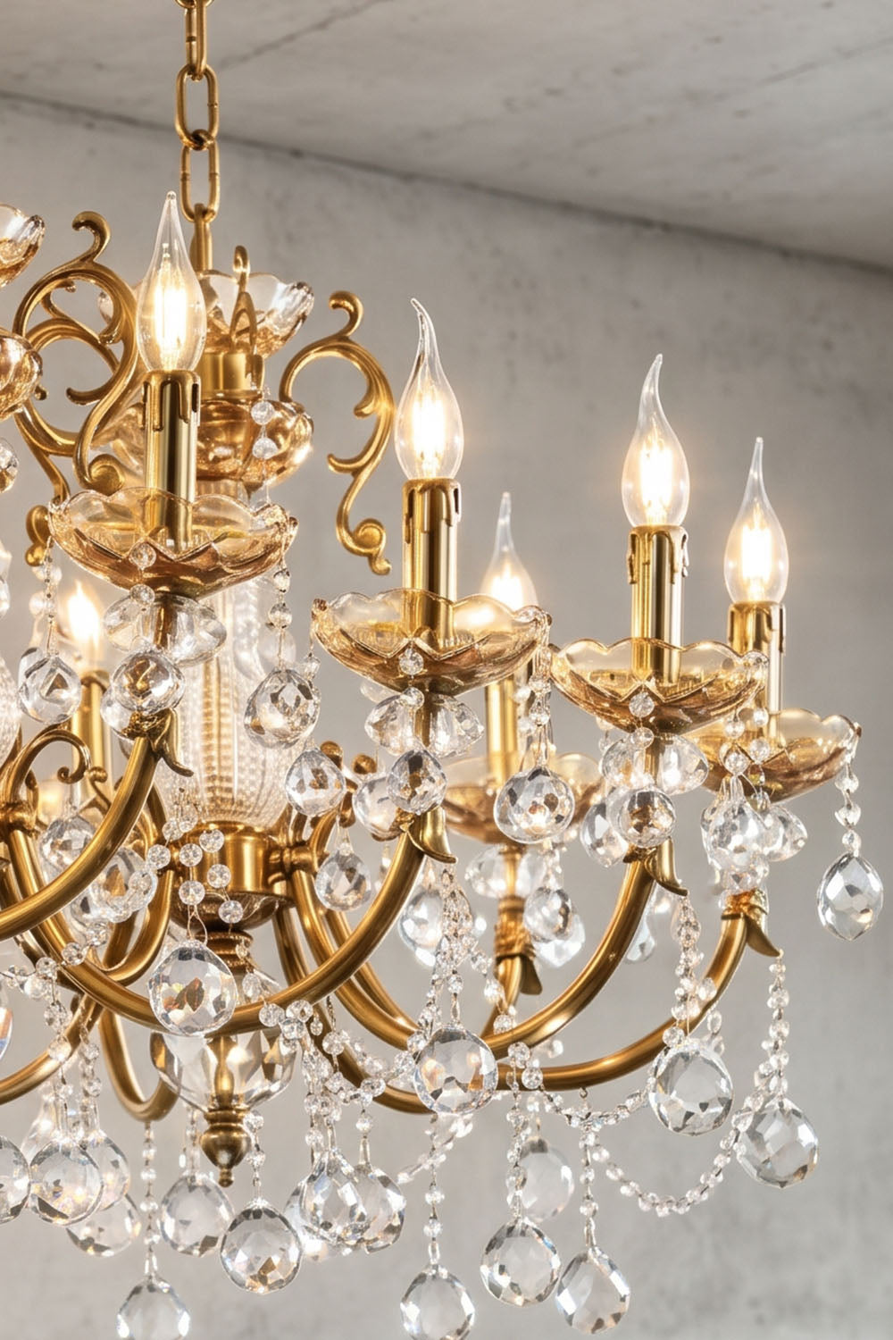 Orbessan Brass Crystal Oval Candle Chandelier | Cut Crystal and Brass | Close-up view highlighting multiple illuminated candle arms and crystal drops | Samu Lamp