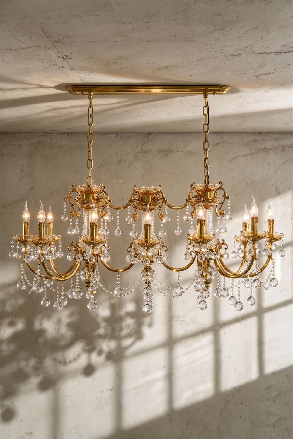 Orbessan Brass Crystal Oval Candle Chandelier | Cut Crystal and Brass | Real-life installation view illuminated gracefully near a ceiling | Samu Lamp