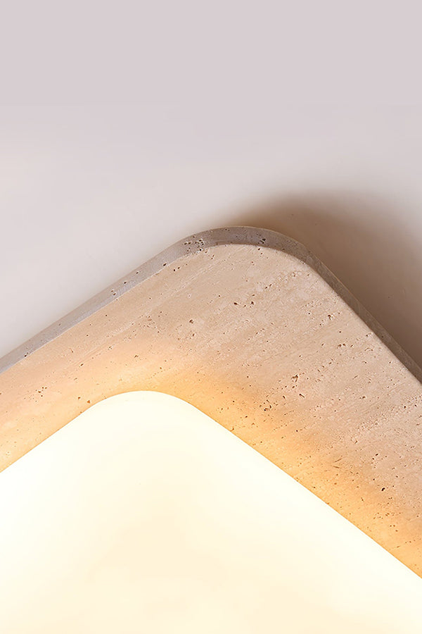 Close-up of travertine corner and lit diffuser | Yellow Travertine, Acrylic | Showing the stone texture and warm light | Samu Lamp