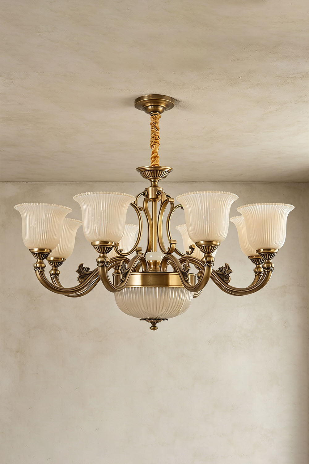 Ormond Fluted Bell Brass Chandelier with elegant glass shades and decorative detailing.