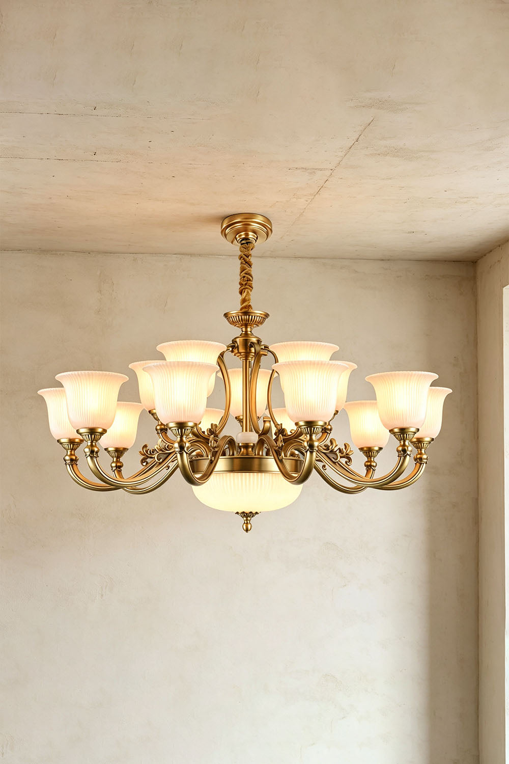 Ormond Fluted Bell Brass Chandelier with elegant glass shades and intricate design in a stylish interior setting.