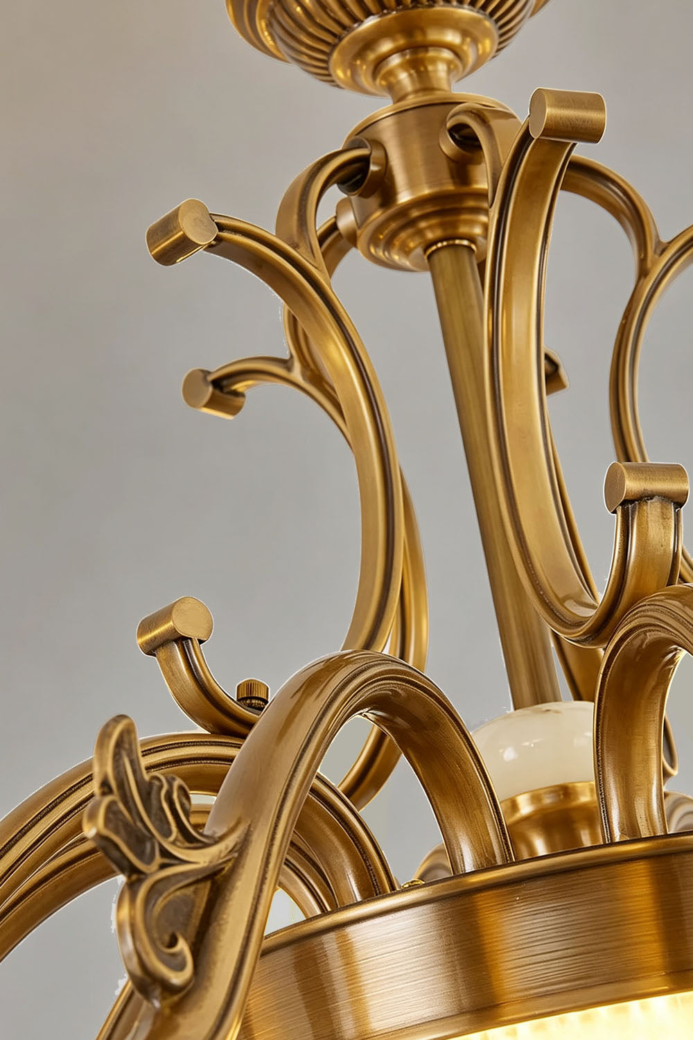 Ormond Fluted Bell Brass Chandelier showcasing intricate gold detailing and elegant design elements.