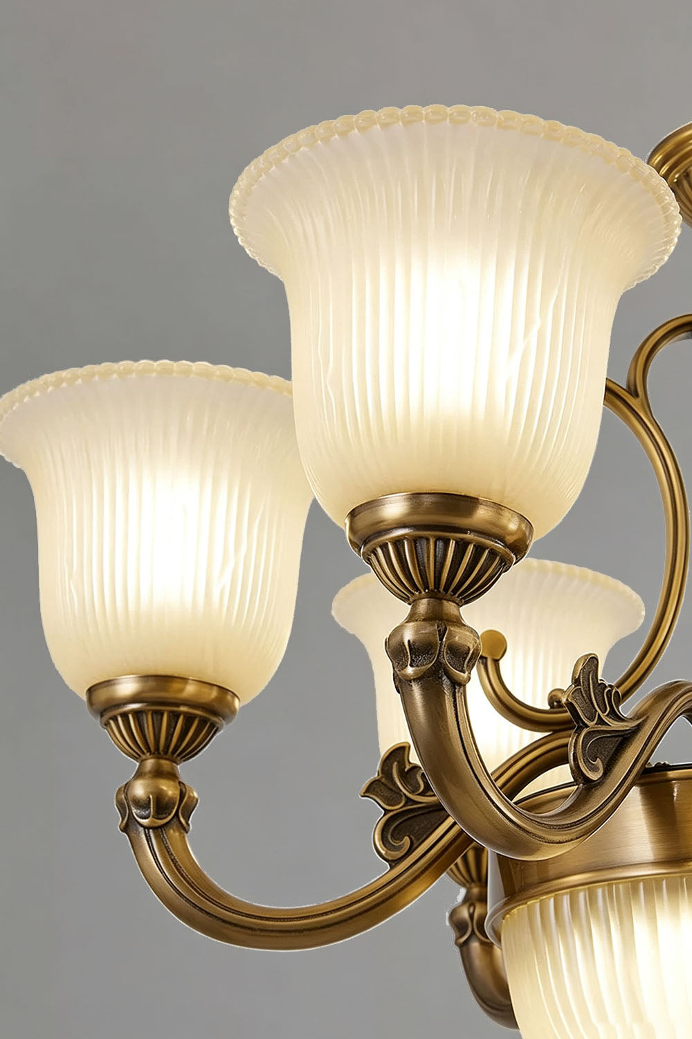 Ormond Fluted Bell Brass Chandelier with elegant frosted glass shades and ornate detailing.