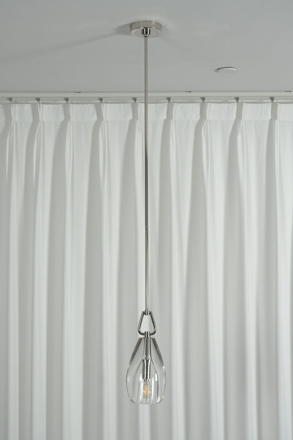 Faucenne Pierced Shade Crystal Spear Wall Lamp | Cut Crystal and Brass | Detail shot highlighting the golden pierced brass shade on dark background | Samu Lamp