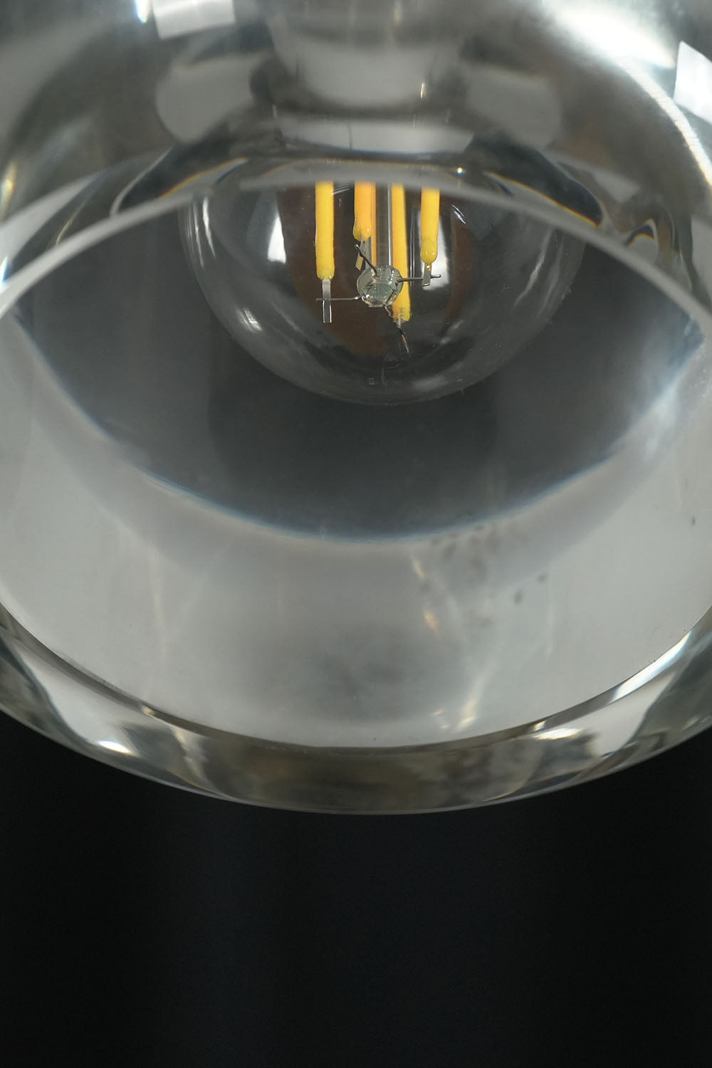 Faucenne Pierced Shade Crystal Spear Wall Lamp | Cut Crystal and Brass | Close-up detail view of the brass mounting hardware and crystal spear | Samu Lamp