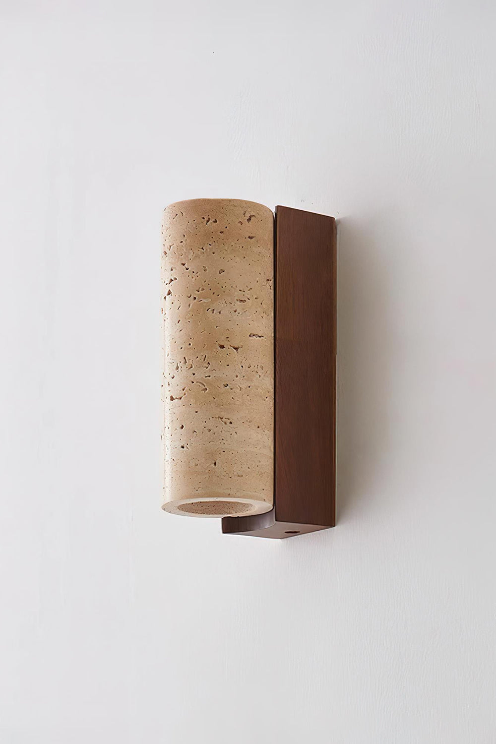 Outcrop Beige Travertine Wall Sconce | Travertine, Metal | Unlit side profile studio view of the organic natural stone wall lamp showcasing its minimalist curved form against a white backdrop | Samu Lamp