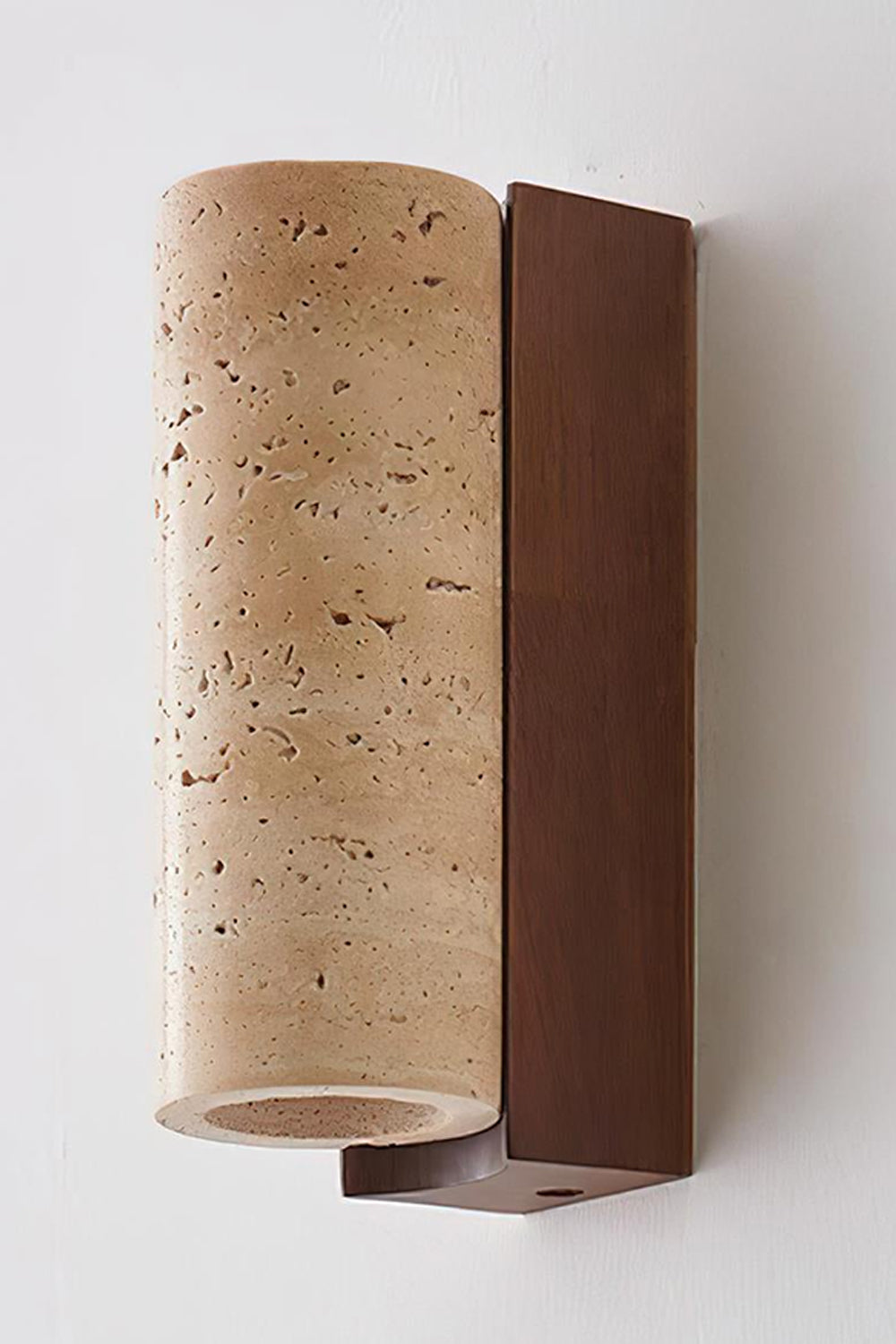 Outcrop Beige Travertine Wall Sconce | Travertine, Metal | Detailed close-up studio shot of the unlit stone sconce highlighting the porous pitted texture of natural beige travertine and dark bronze bracket | Detail shot | Samu Lamp