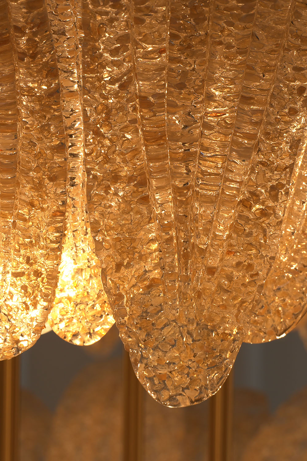 Palmonde Palm Leaf Chandelier | Textured Art Glass | Macro detail of glowing amber glass edge with gold flecks | Samu Lamp