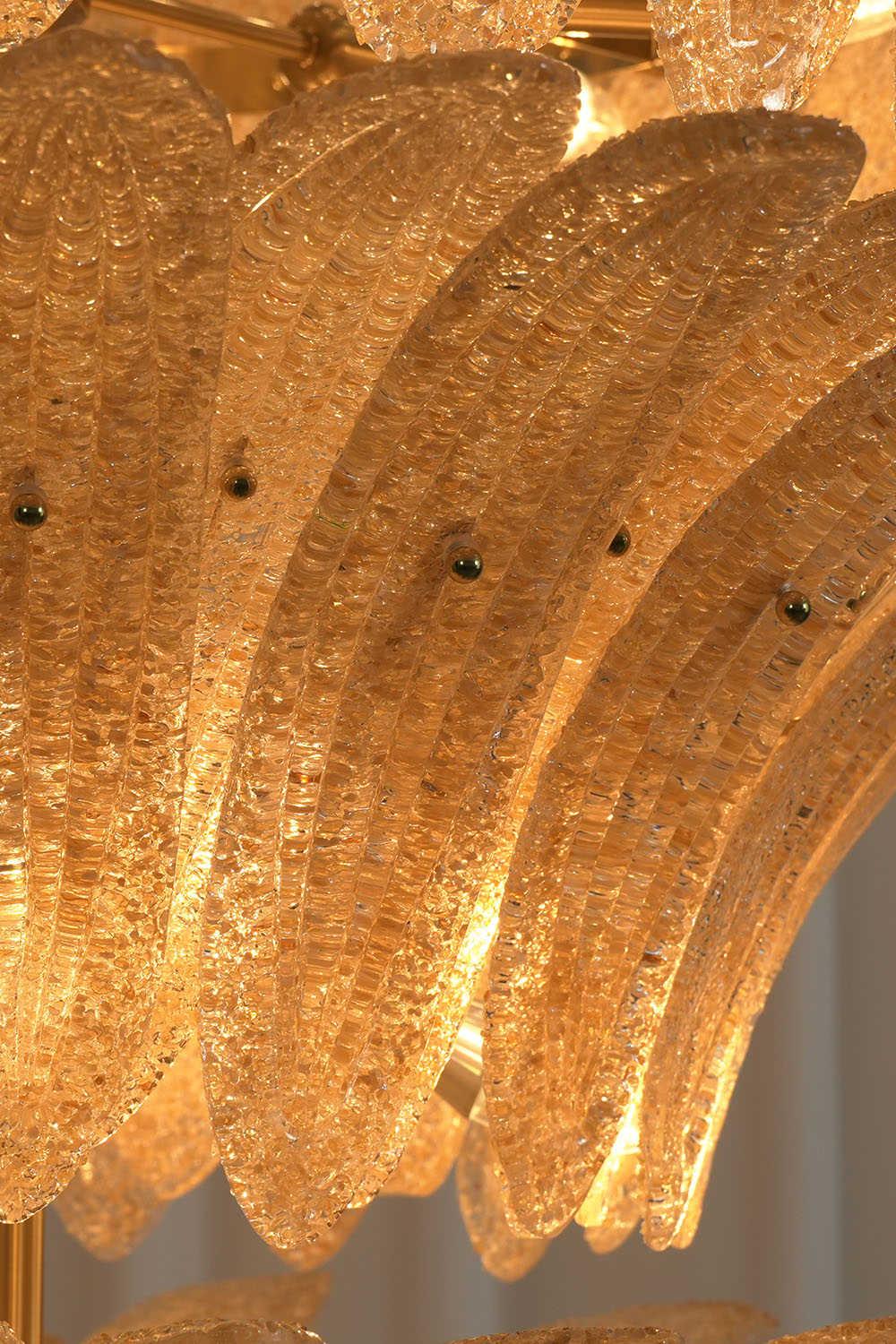 Palmonde Palm Leaf Chandelier | Amber Glass and Brass | Detailed view of layered cascading palm leaf glass | Samu Lamp