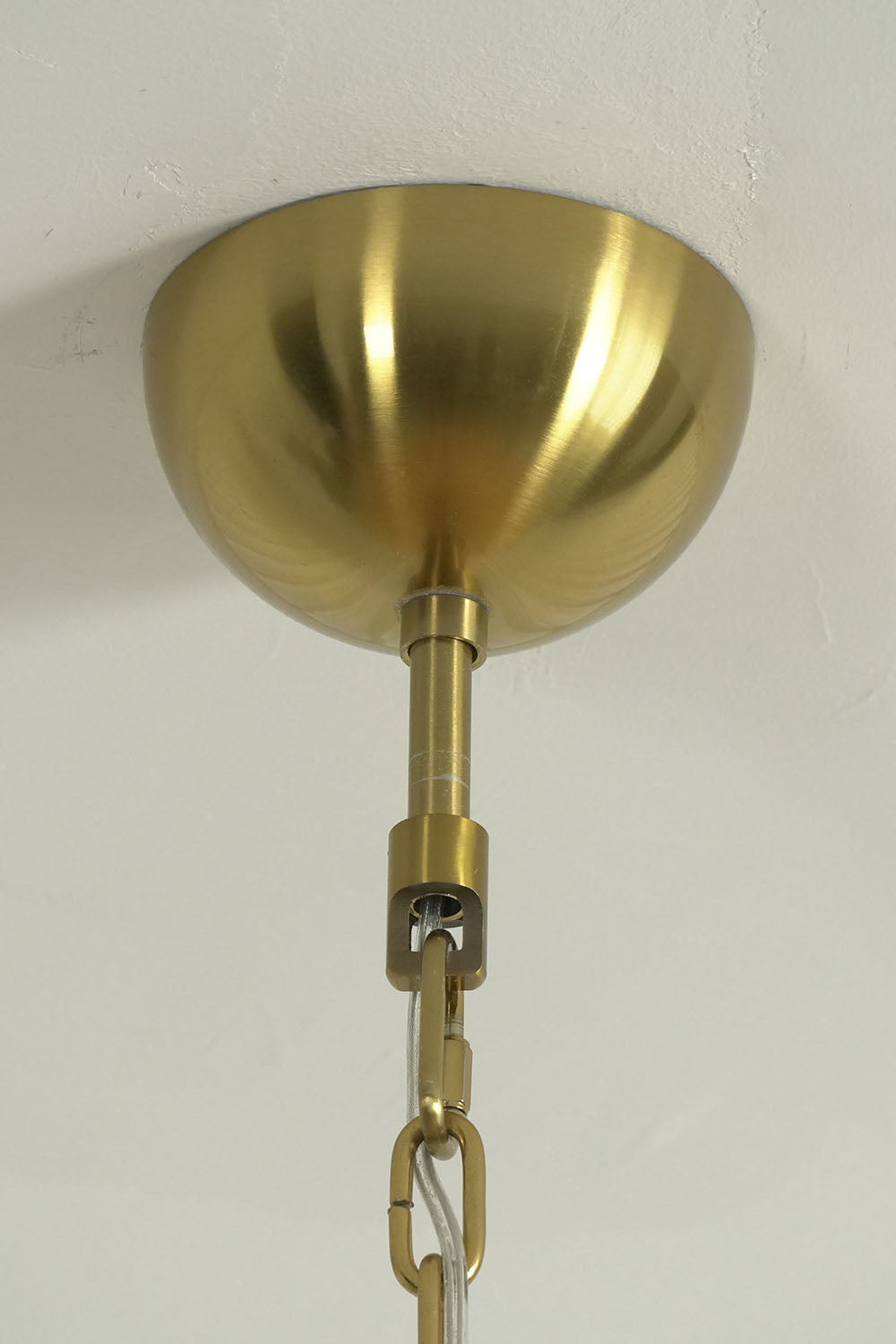 Palmonde Palm Leaf Chandelier | Solid Brushed Brass | Close-up of round ceiling canopy, loop, and brass chain | Samu Lamp