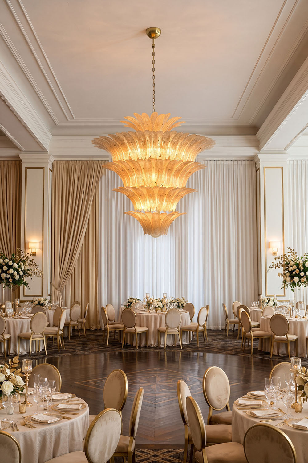 Palmonde Palm Leaf Chandelier | Amber Glass and Brass | Centerpiece in an opulent banquet hall with round tables | Samu Lamp