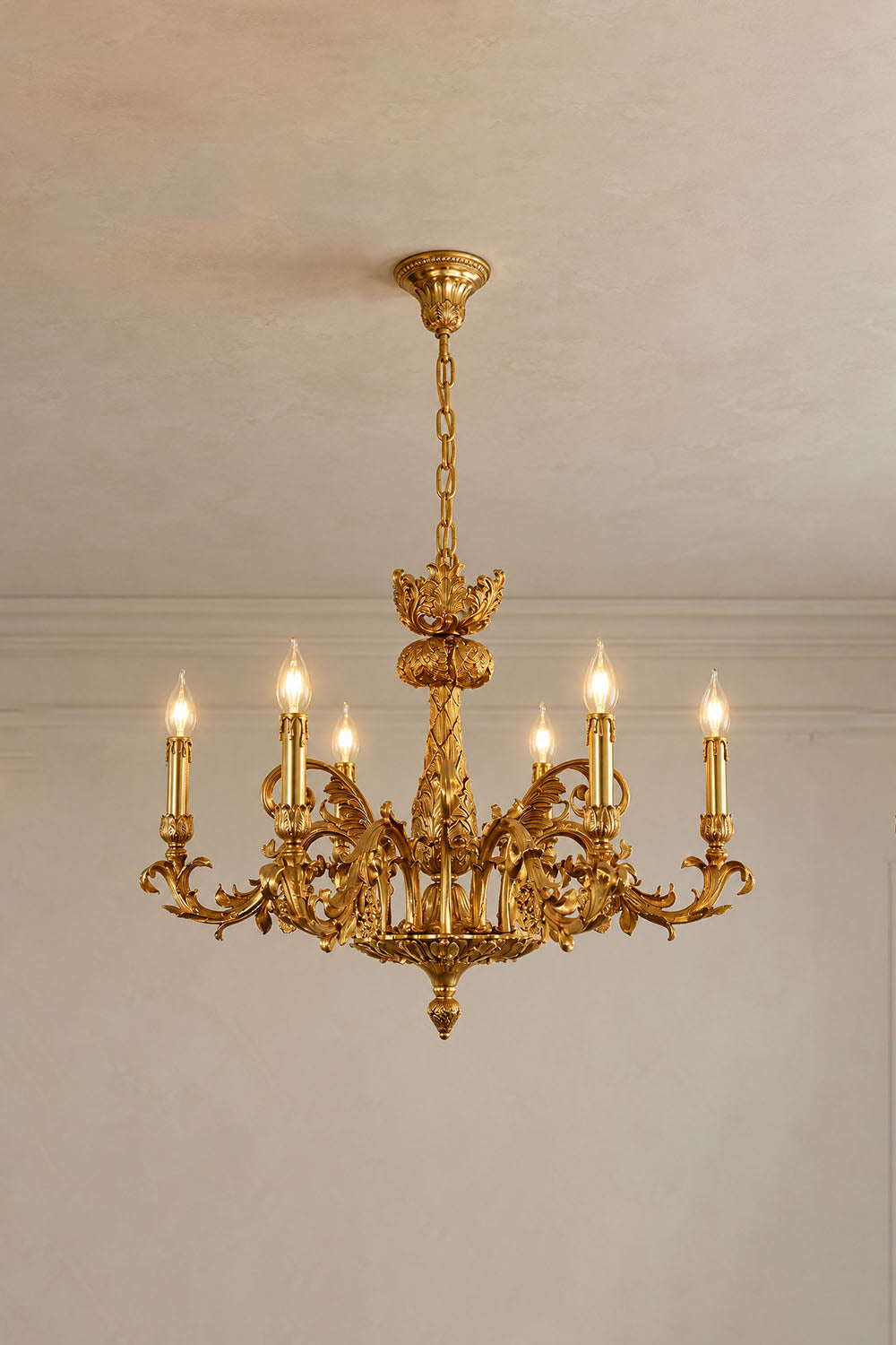 Pamprelle Brass Acanthus Grape Chandelier | Cast Brass | Variant lit gracefully on a neutral wall | Samu Lamp