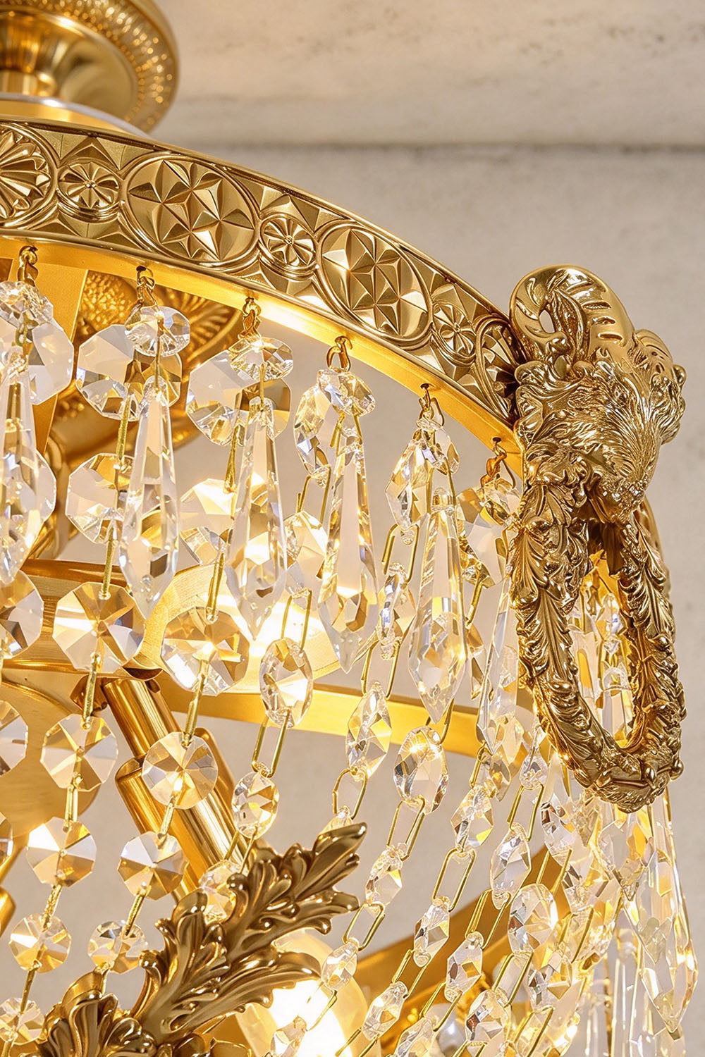 Pellerine Brass Wreath Crystal Semi-Flush Ceiling Light | Cut Crystal and Brass | Close-up view of the carved brass wreath bow motif and crystal drops | Samu Lamp