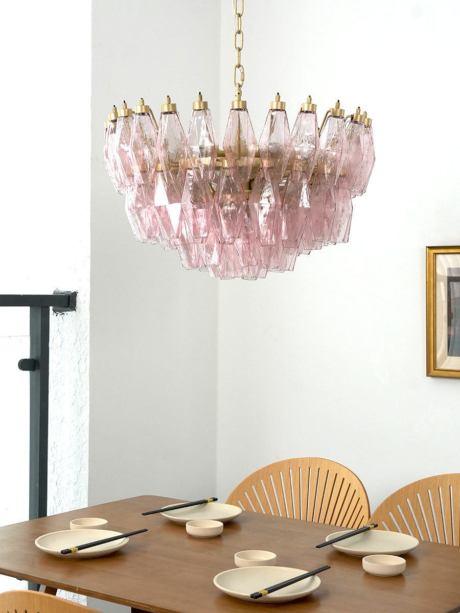 Pink art glass chandelier providing warm glow | Metal, Glass | Alternative view in a dining area over a set table | Samu Lamp