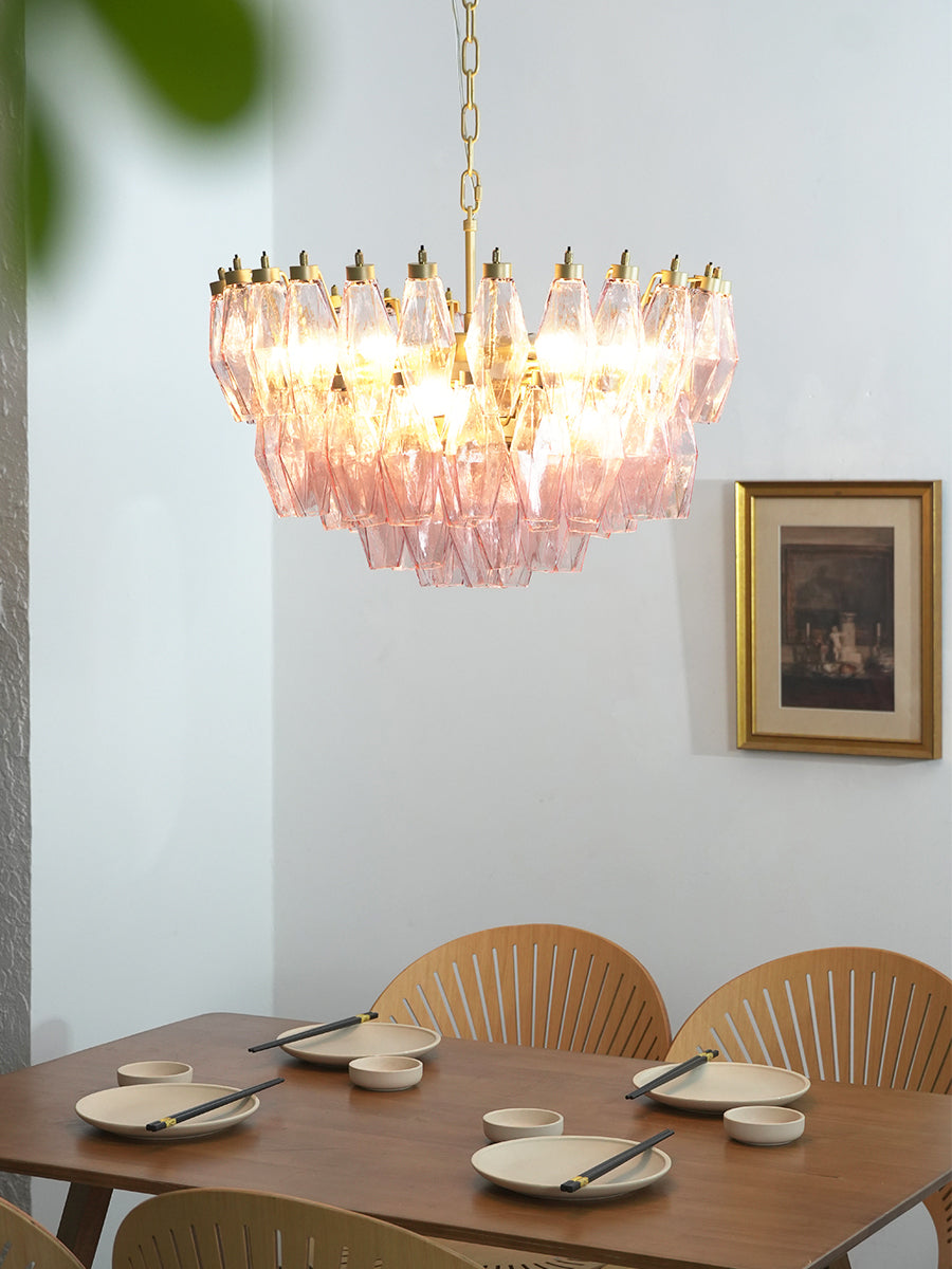 Pink glass polyhedron chandelier in a traditional dining room | Metal, Glass | Over a wooden table with wicker chairs | Samu Lamp