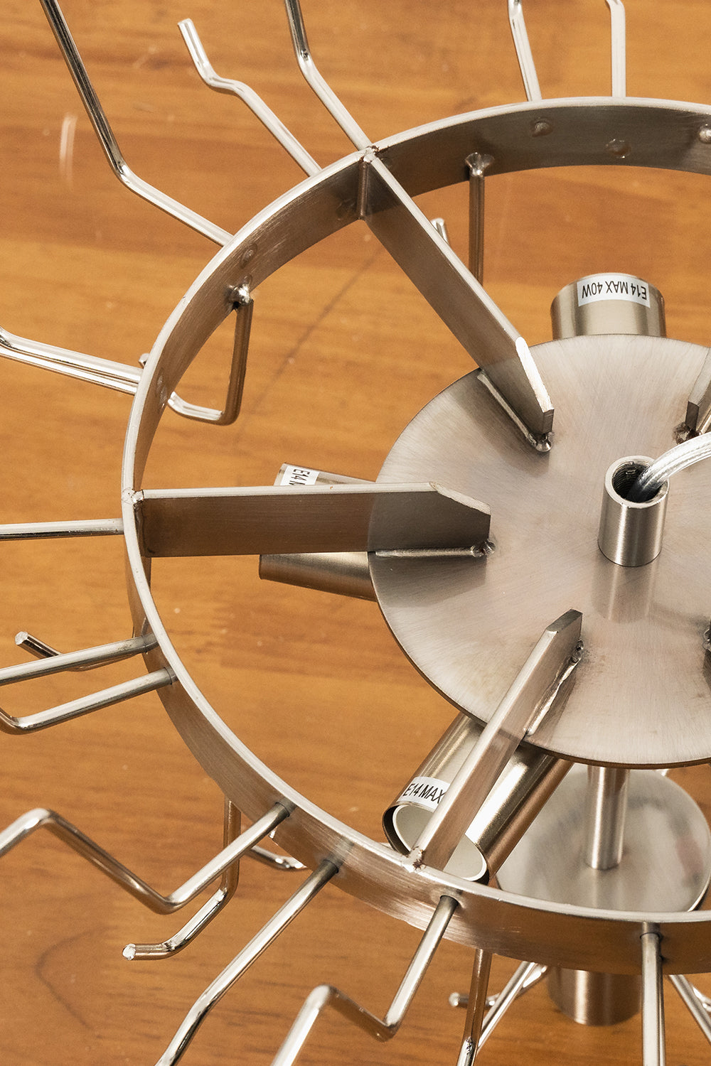 Amara Blush Cascading Glass Chandelier | Glass, Metal | Top-down view of the concentric silver metal frame structure showing the hanging hooks and arms | Detail shot | Samu Lamp