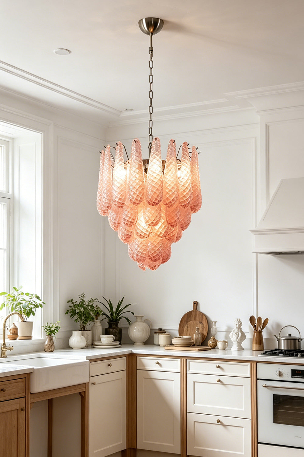 Amara Blush Cascading Glass Chandelier | Glass, Metal | Providing warm ambient light in a bright classic kitchen with cream cabinetry and wood floors | Samu Lamp