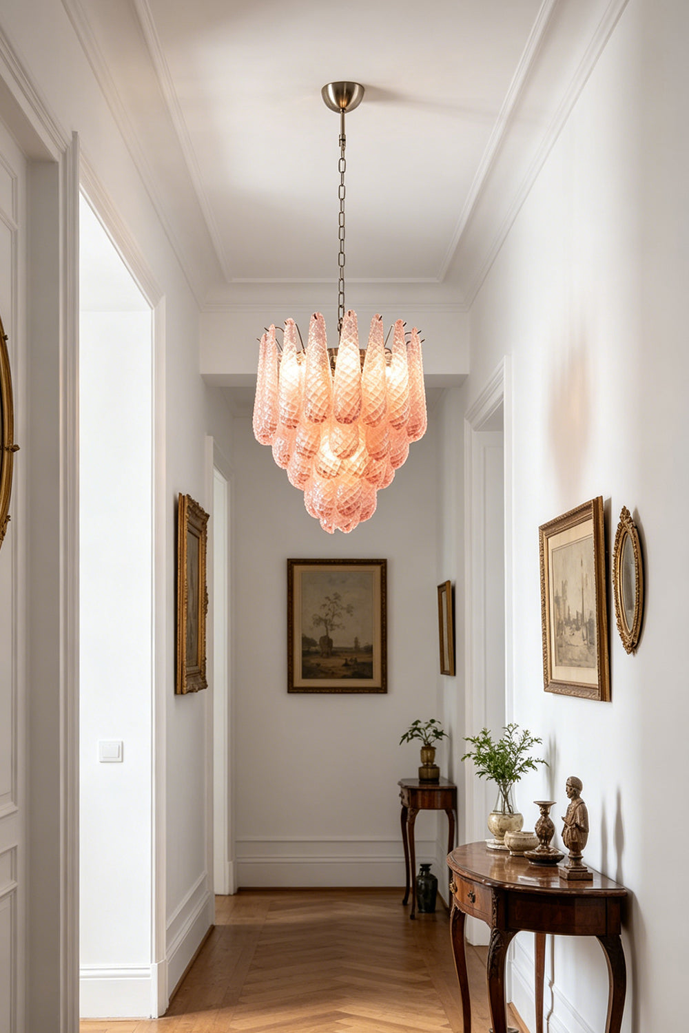 Amara Blush Cascading Glass Chandelier | Glass, Metal | Hanging as a statement centerpiece in a long, elegant minimalist white hallway | Samu Lamp