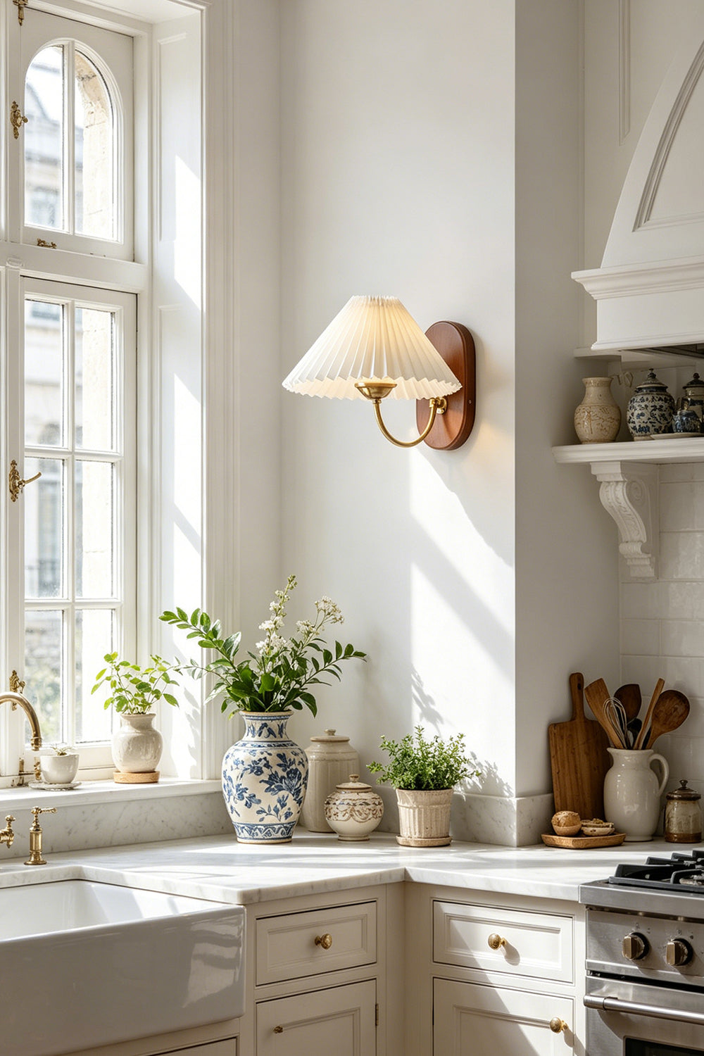 Pleated Fabric Wall Lamp | Fabric, Metal, Wood | Wall-mounted near a bright window over a modern classic kitchen counter with white cabinetry | Samu Lamp