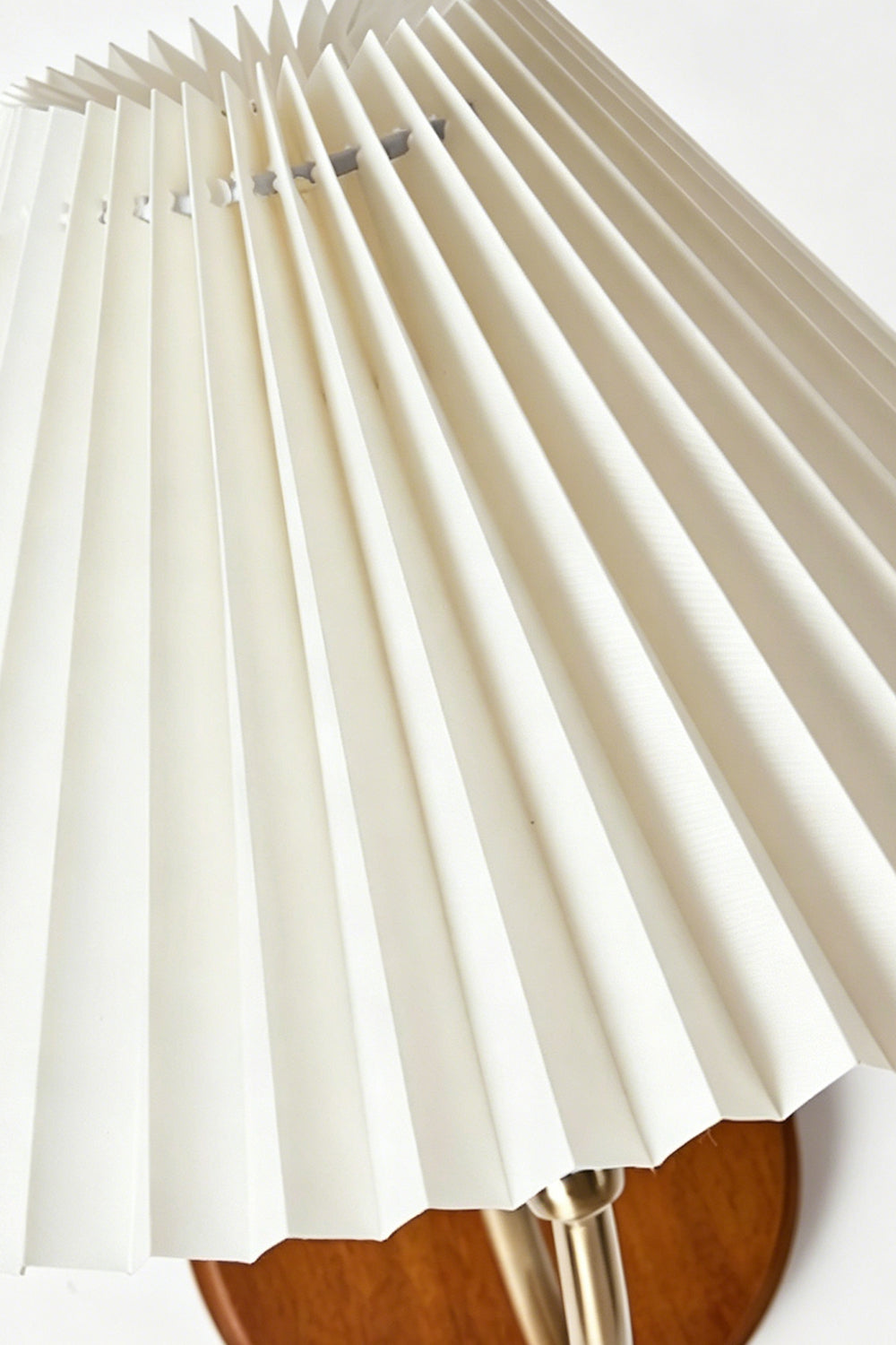 Pleated Fabric Wall Lamp | Fabric, Metal, Wood | Macro close-up of the crisp vertical folds on the unlit cream fabric lampshade | Detail shot | Samu Lamp