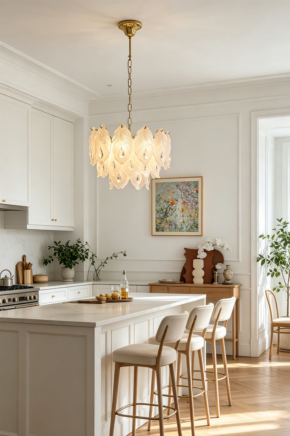 Pluma Frosted Glass Feather Chandelier | Glass, Metal | Suspended as an elegant statement accent light above a pristine white kitchen island counter with matching bar stools | Samu Lamp