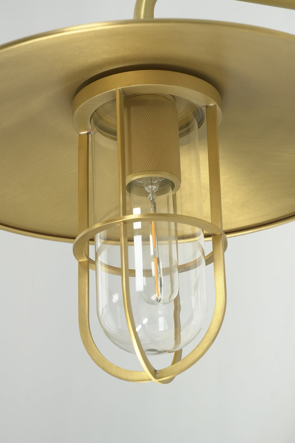 Detailed view of the brass cage and glass tube | Brass, Glass | Macro shot of the Portree lamp head | Samu Lamp