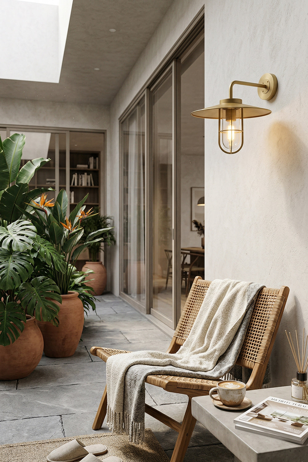 Nautical style brass wall light for outdoor balcony | Brass, Glass | Installed on a white wall near glass doors | Samu Lamp