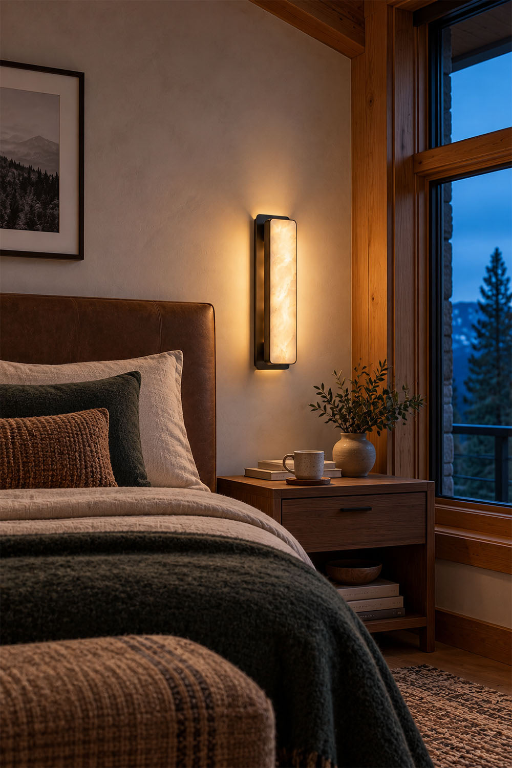 Quadrelle Wall Sconce | Alabaster and Brass | Bedside wall-mounted lighting in a cozy rustic bedroom | Samu Lamp