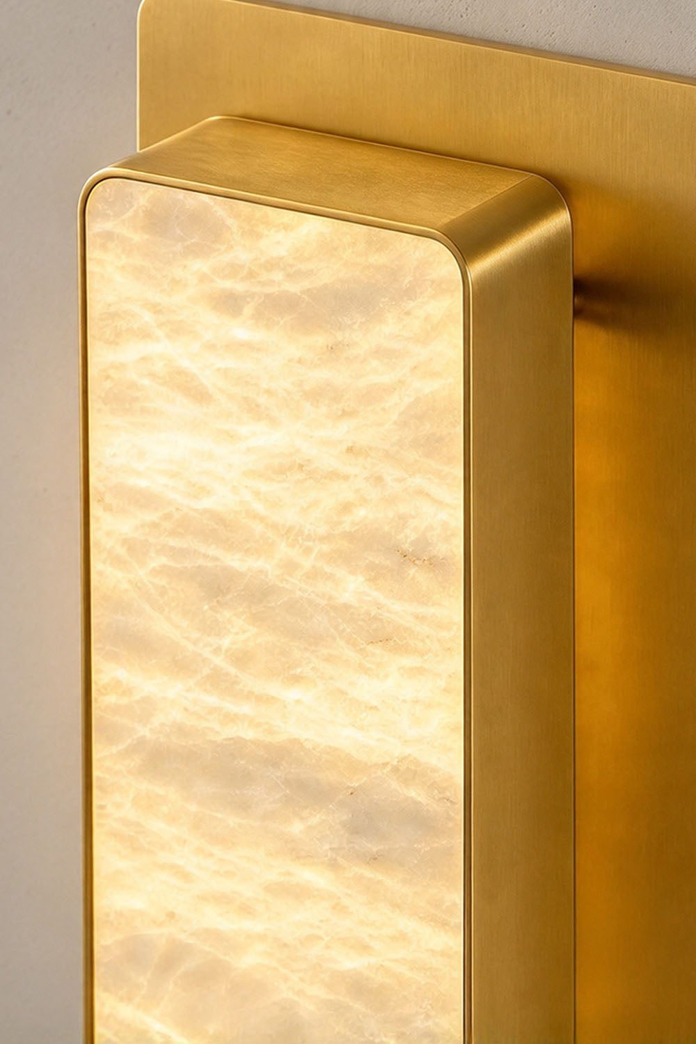 Quadrelle Wall Sconce | Translucent Alabaster | Macro detail of rectangular stone diffuser and brass rim | Samu Lamp