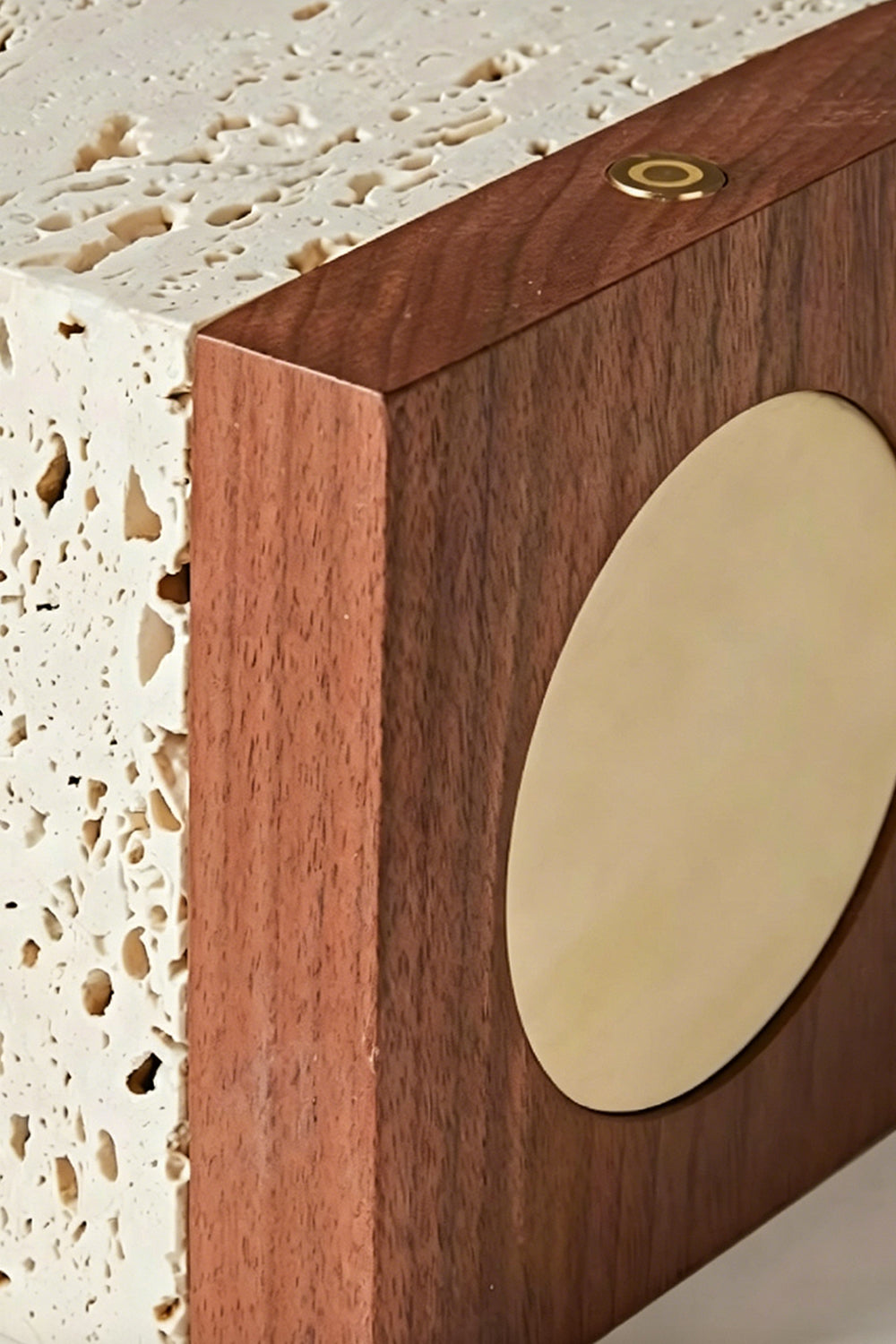 Radiant Monolith Travertine Table Lamp | Travertine, Wood | Extreme close-up side view | Gold switch and wood base detail | Travertine texture close-up | Samu Lamp