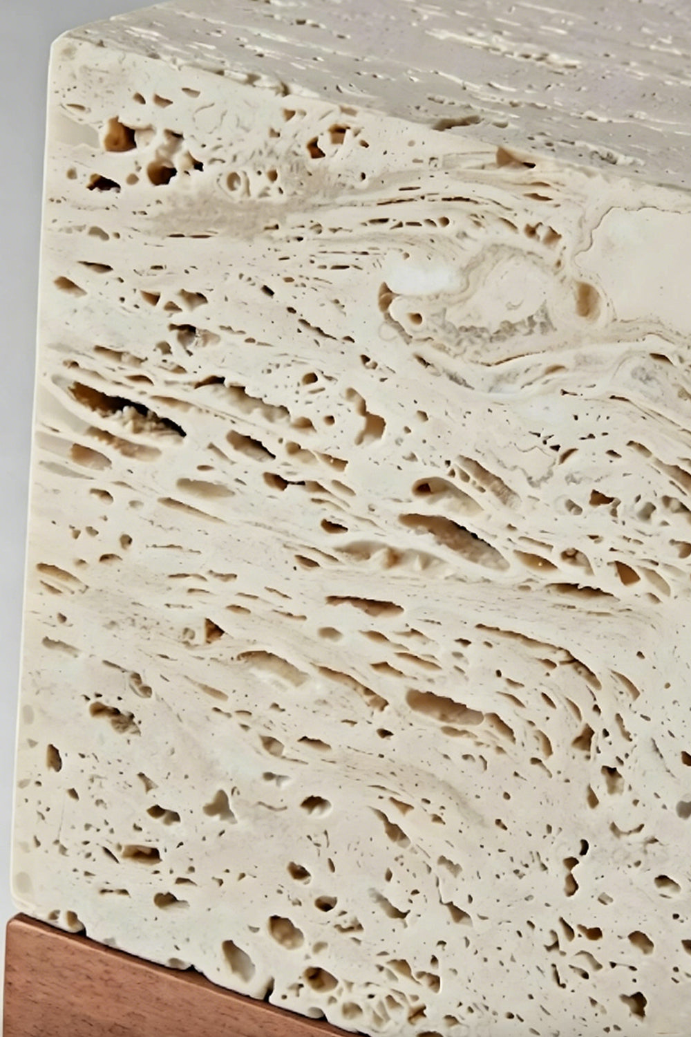 Radiant Monolith Travertine Table Lamp | Travertine | Extreme close-up surface texture | Porous stone voids and pits detail | Raw natural stone texture | Samu Lamp