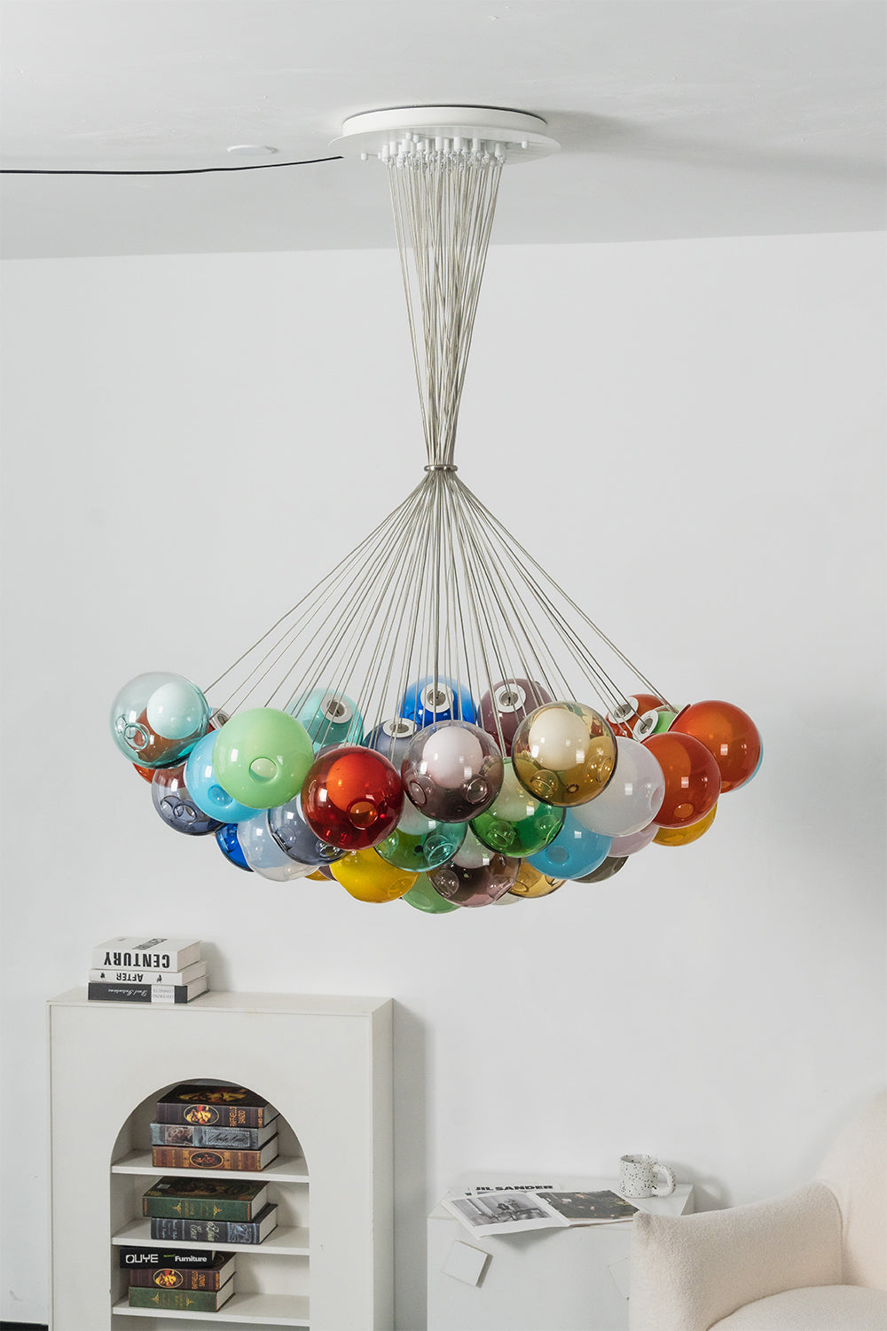 Rainbow Glass Bubble Cluster Chandelier | Glass, Metal | Complete frontal view of the colorful cluster fixture suspended elegantly over a minimalist white sideboard console | Samu Lamp