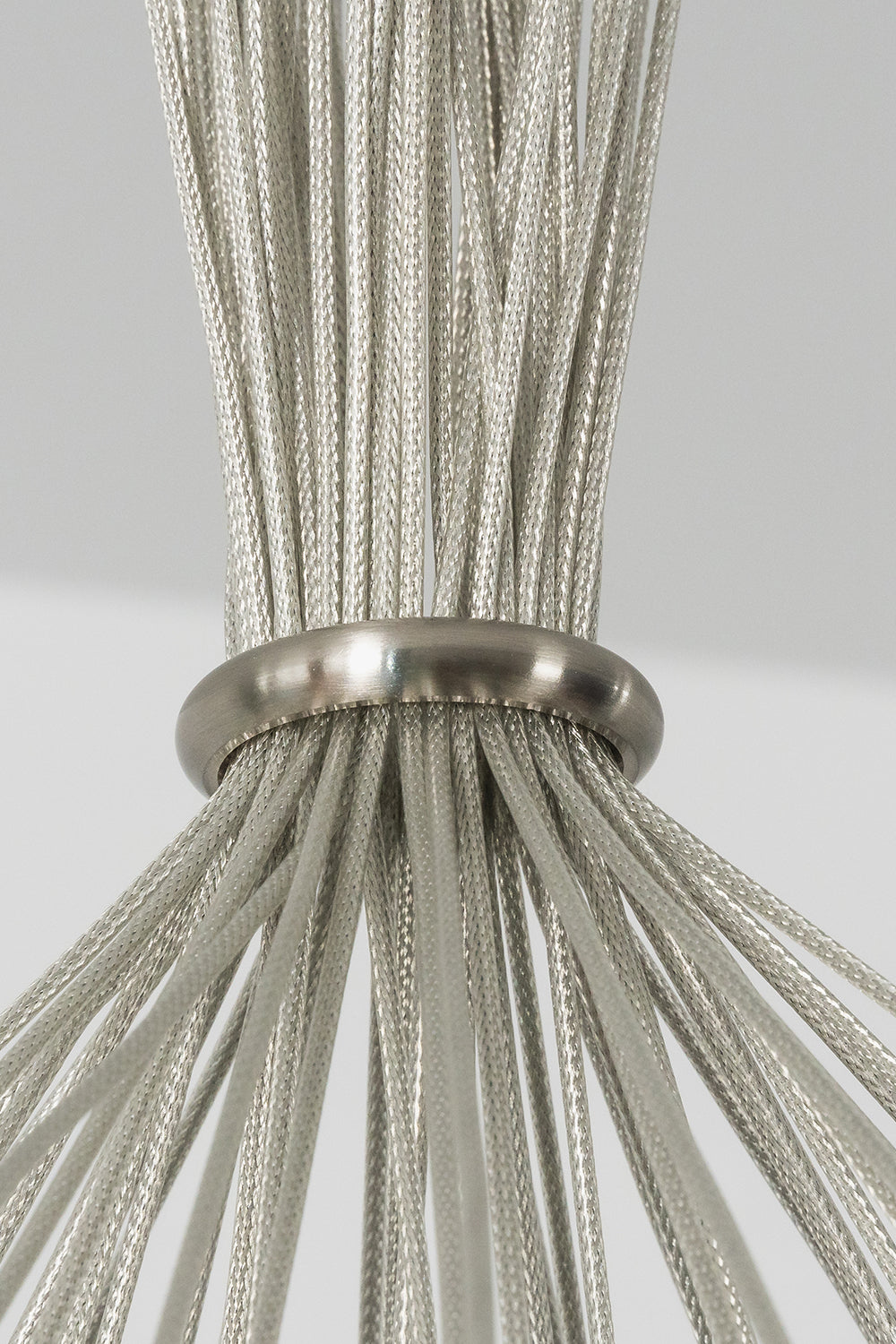 Rainbow Glass Bubble Cluster Chandelier | Glass, Metal | Close-up macro focus on the gathered silver steel mesh cables passing through a polished chrome collar ring | Detail shot | Samu Lamp