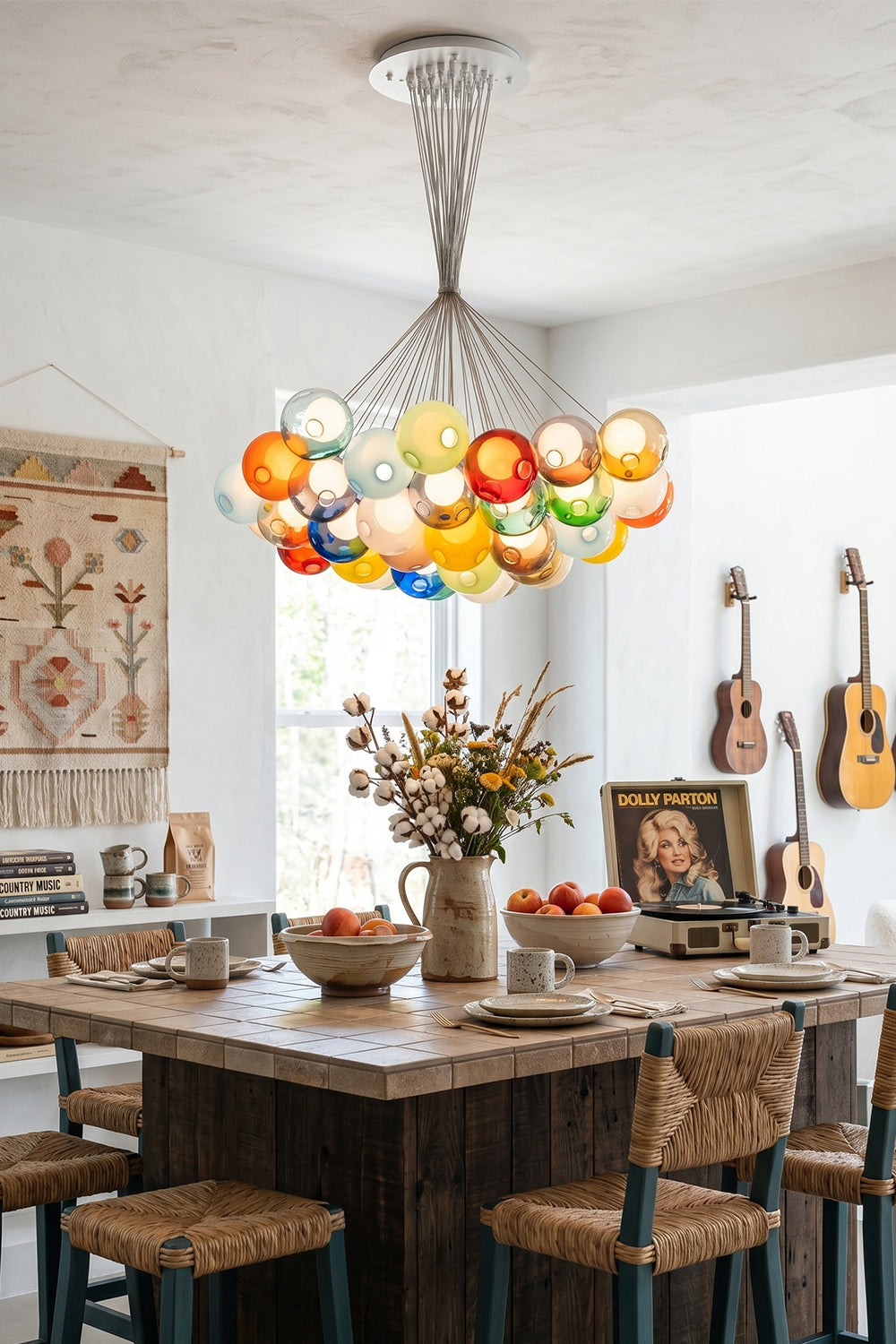 Rainbow Glass Bubble Cluster Chandelier | Glass, Metal | Providing a playful pop of color over a square wooden dining table in a warm bohemian room with guitars | Samu Lamp