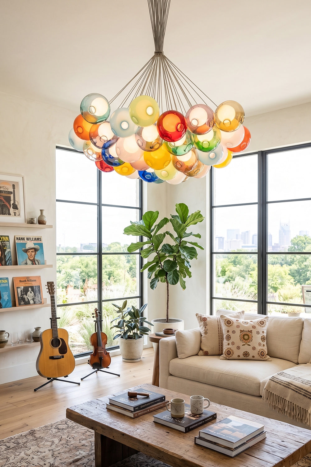 Rainbow Glass Bubble Cluster Chandelier | Glass, Metal | Illuminating a bright, contemporary lounge room featuring a cream sectional sofa and large windows with greenery views | Samu Lamp