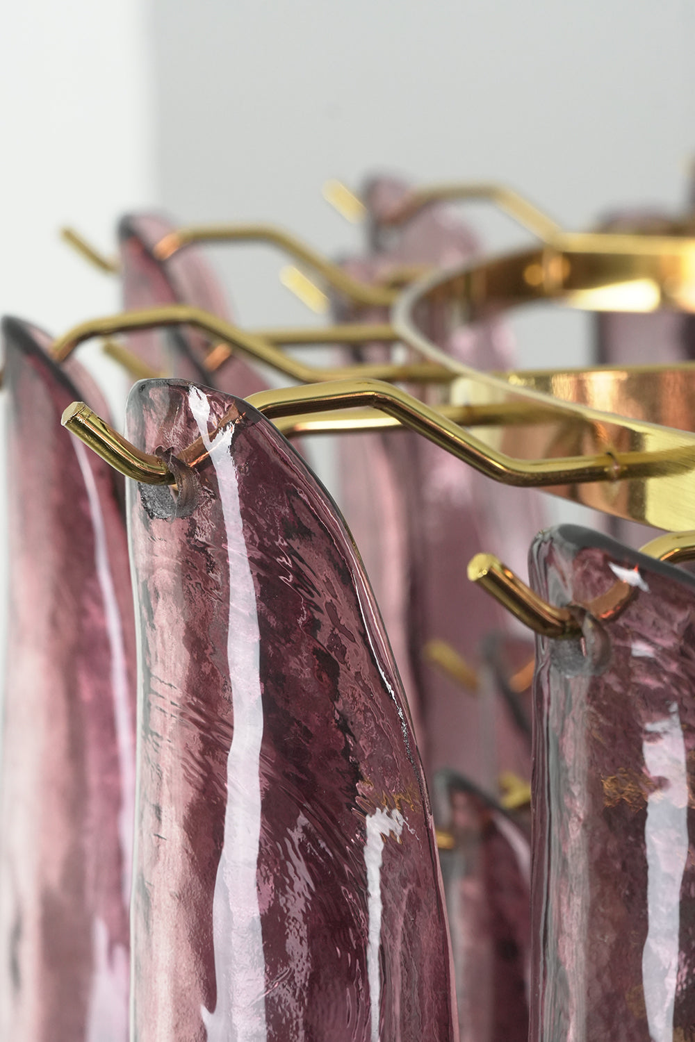 Regal Purple Cascade Chandelier | Glass, Metal | Macro view of the gold metal hooks and textured purple glass petals | Detail shot | Samu Lamp