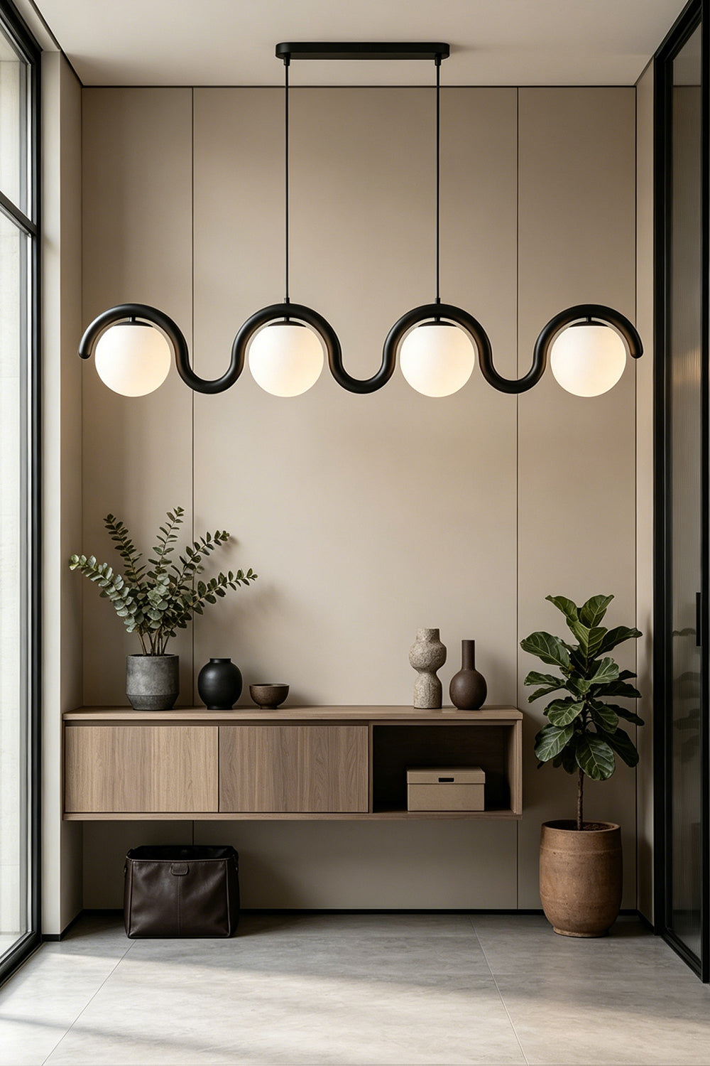 Rhythmic flow glass pendant with wavy black metal frame | Metal, Glass | Installed over a console table in a bright hallway | Samu Lamp