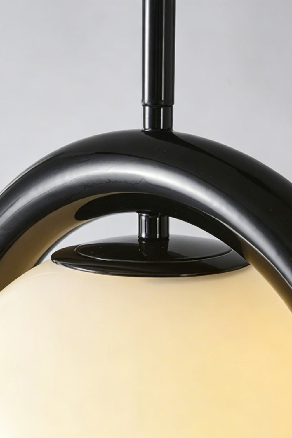 Close-up of the rhythmic flow pendant in black finish | Metal, Glass | Detailed shot of the metal bracket and cord connection | Samu Lamp