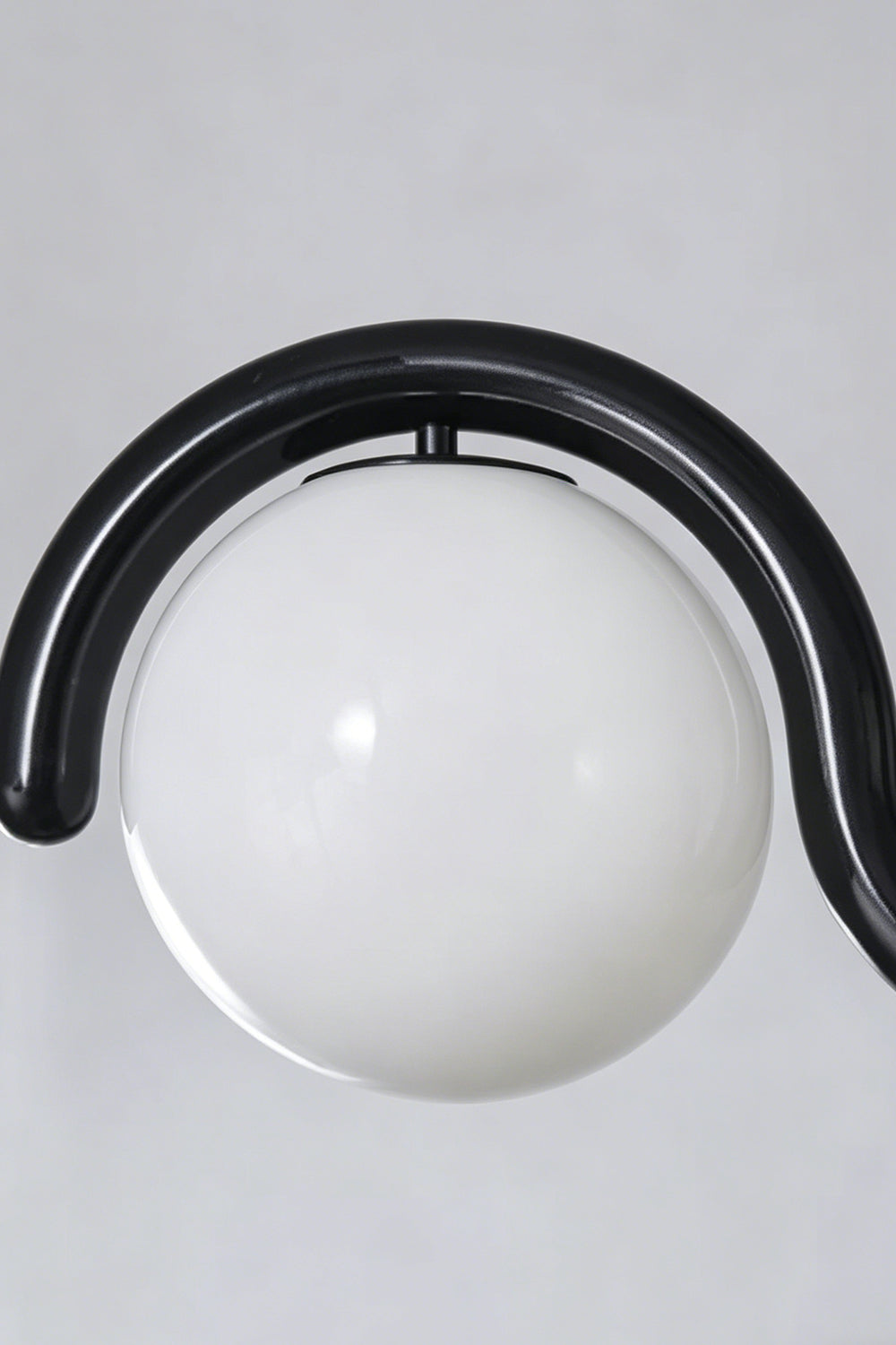 Close-up of the rhythmic flow pendant in black finish | Metal, Glass | Detailed shot of the metal bracket and cord connection | Samu Lamp