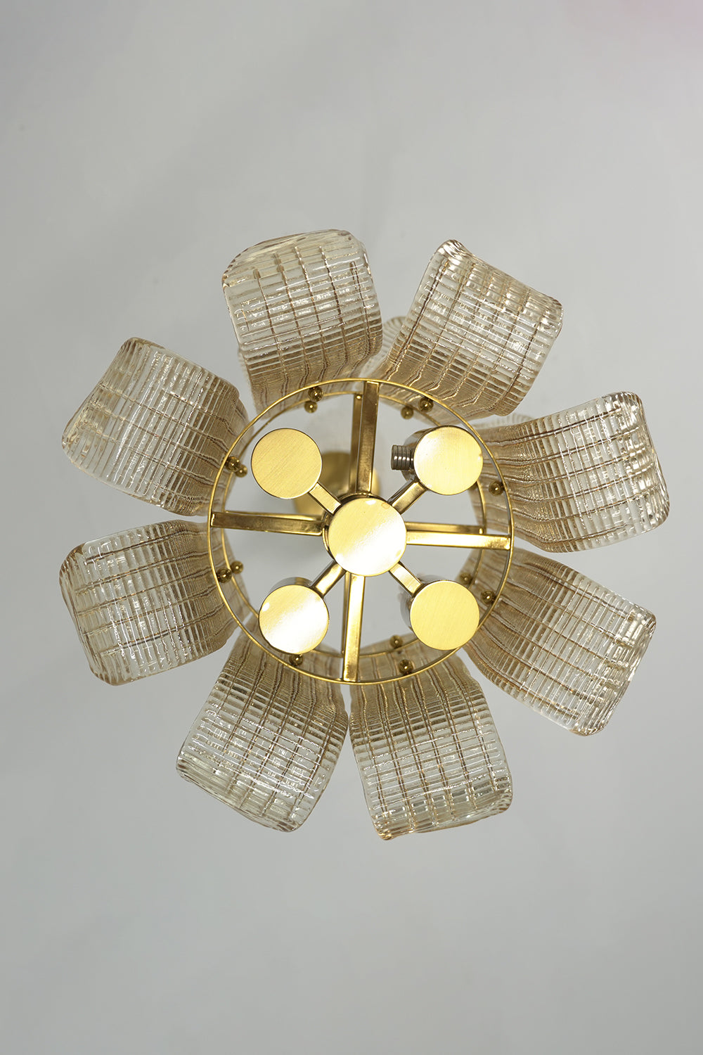 Ribbed glass scroll chandelier from below | Metal | Glass | Showing the flower-like symmetrical arrangement of glass panels | Samu Lamp