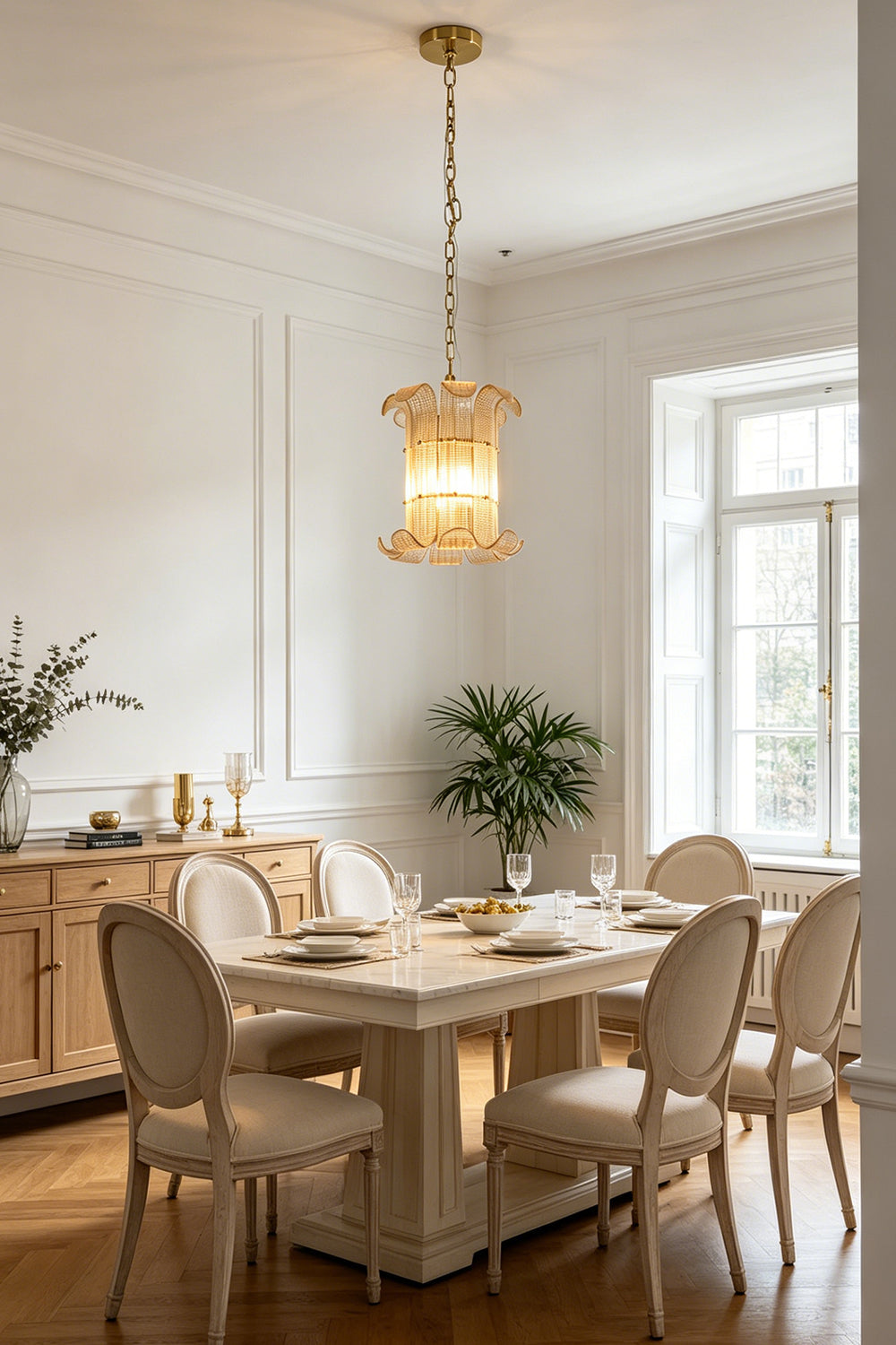 Luxurious scroll ribbed glass pendant light | Metal | Glass | Centered over a white dining table with classic chairs | Samu Lamp