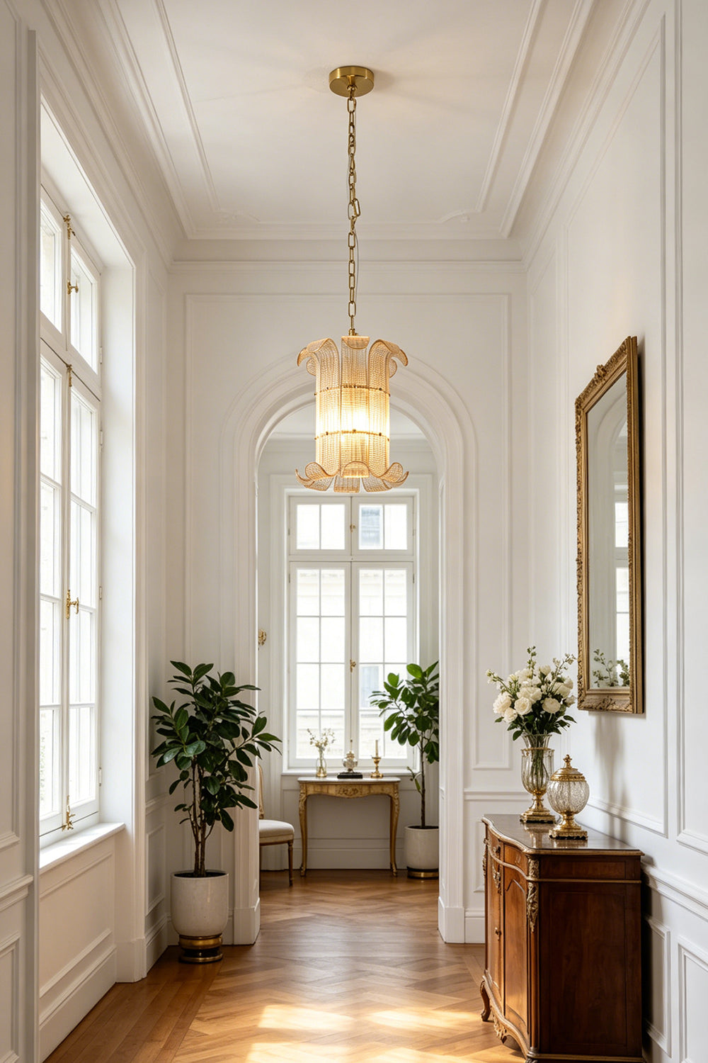 Tall scroll ribbed glass chandelier | Metal | Glass | Hanging in a sophisticated high-ceiling hallway corridor | Samu Lamp