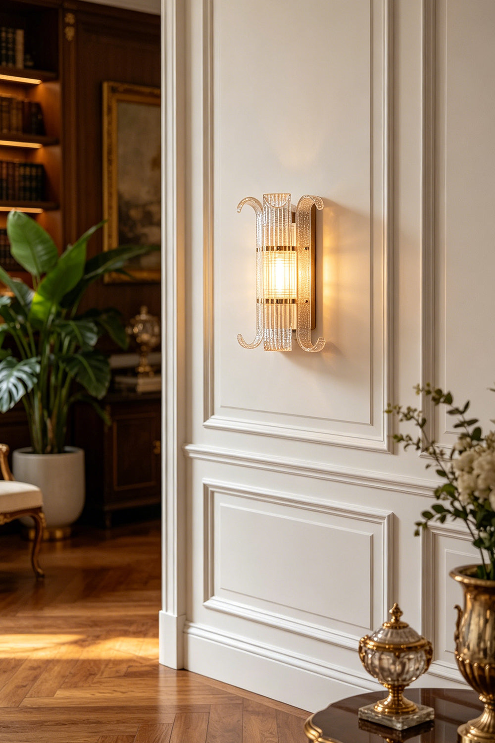 Ribbed Glass Scroll Wall Lamp providing warm bedside lighting | Metal, Glass | Installed above a queen bed with white bedding | Samu Lamp