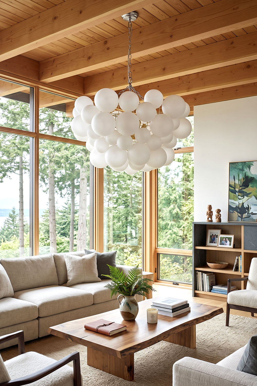 Romilly Frosted Globe Cluster Chandelier | Frosted Glass and Brass | Suspended in a spacious living room featuring a wood ceiling and beige sofa | Samu Lamp